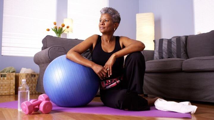 Middle aged woman relaxing after workout